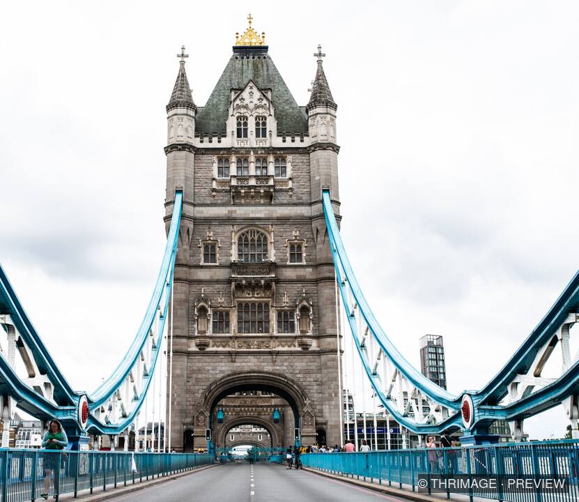 Symmetrical view of Tower Bridge tower and blue suspension structure