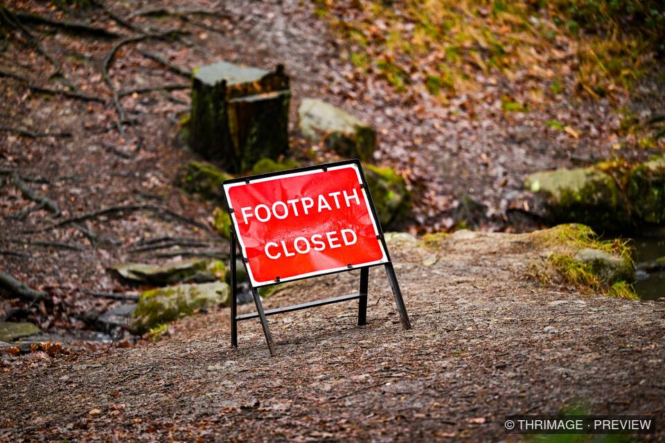 Red Footpath Closed sign on a woodland path